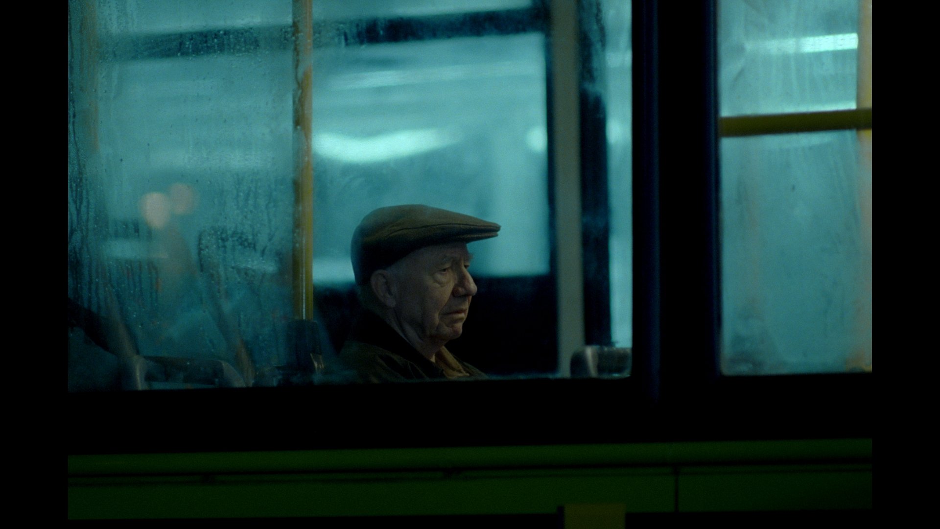 Man sits alone on bus